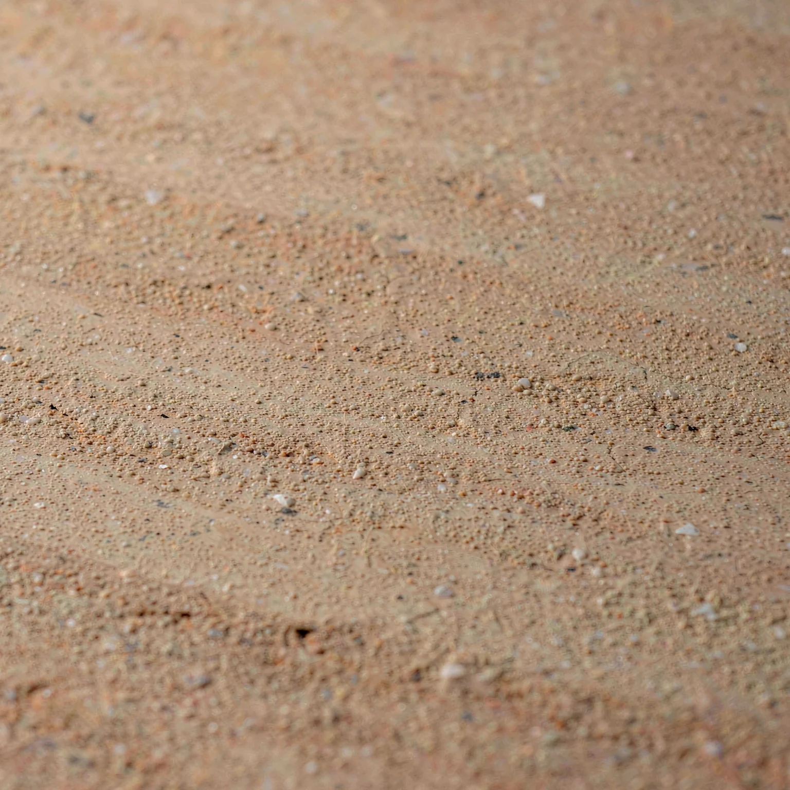 Close-up of warm sand with sediment layers